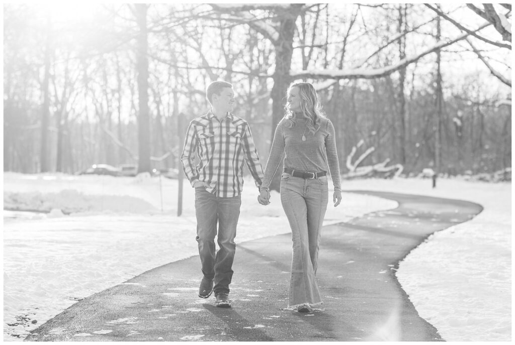 engaged couple walking together at the park for session in Lewis Center, Ohio