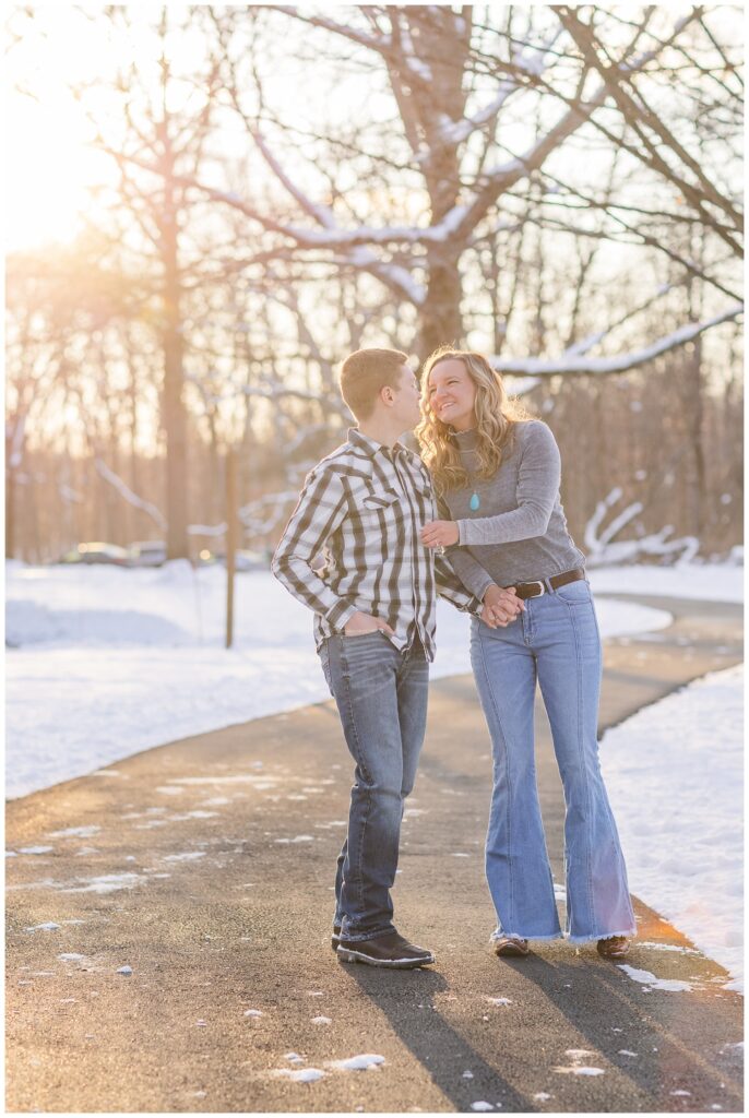 couple laughing and walking together at the park in Lewis Center, Ohio