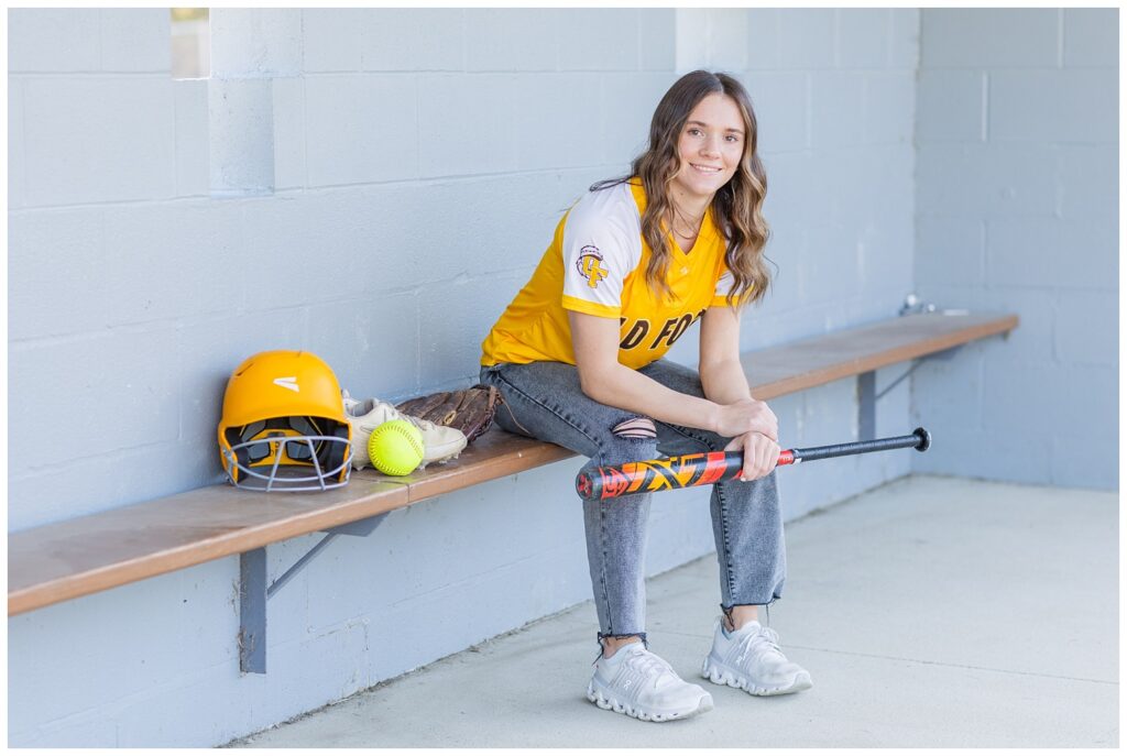 senior session in a softball dugout in Old Fort, Ohio