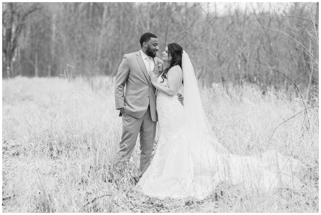 wedding couple posing in a field in Bradner, Ohio