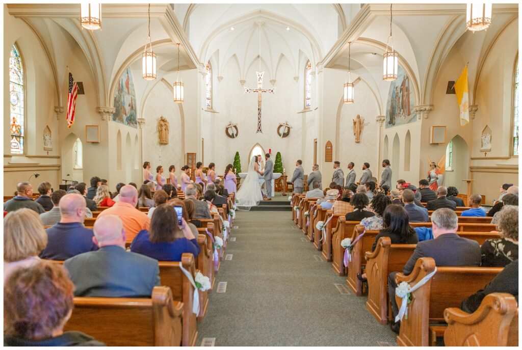 wide portrait of the church wedding by photographer in Fremont, Ohio