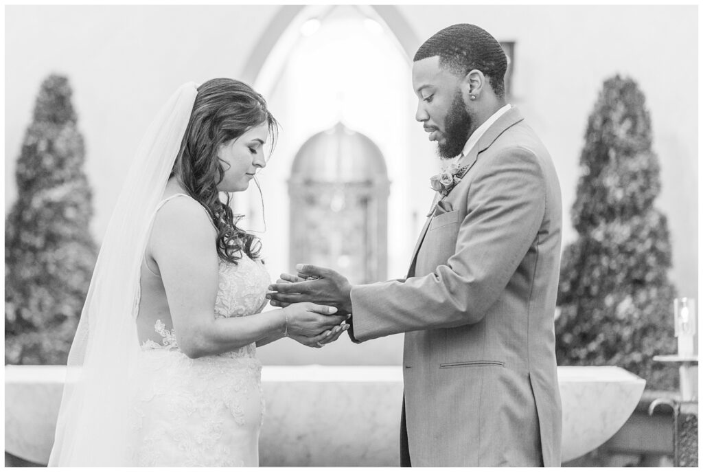 wedding couple exchanging rings at Bradner, Ohio church 