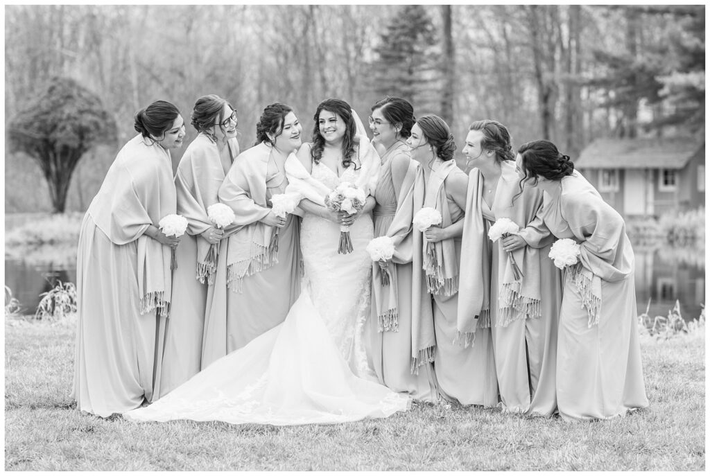 bride laughing with bridal party at Bradner Preserve outdoors at spring wedding