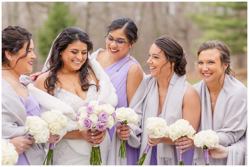 bride laughing with bridal party at Bradner Preserve outdoors at spring wedding