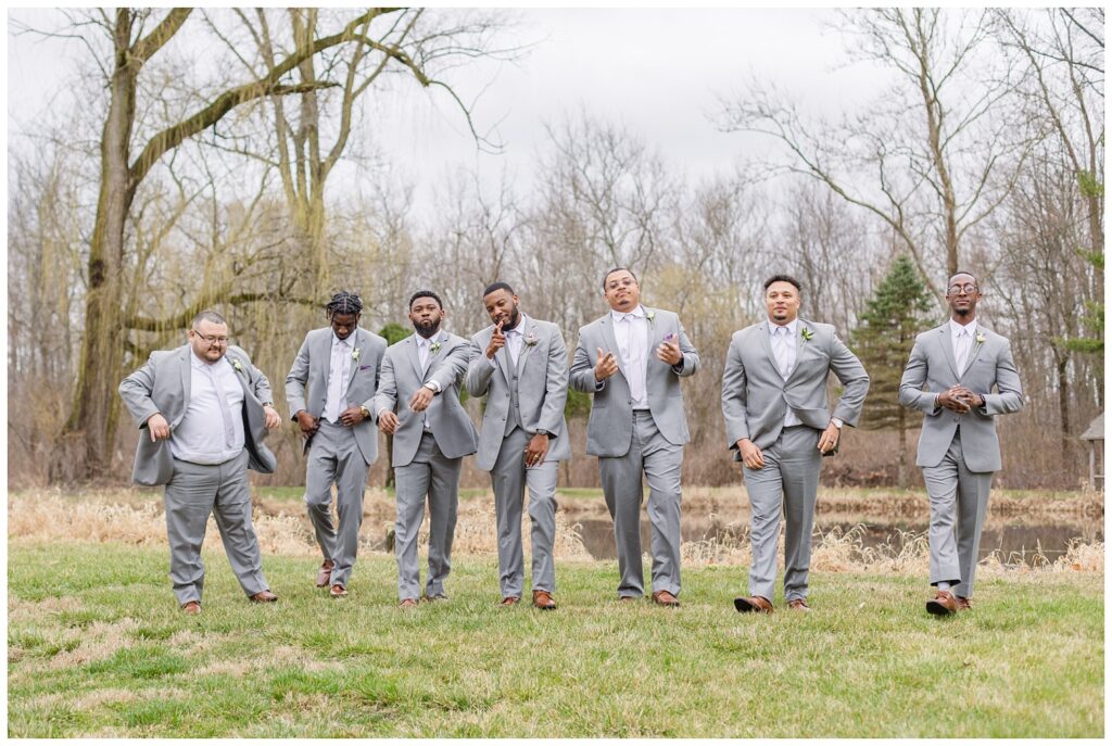 groomsmen all walking together trying to look cool in Fremont, Ohio