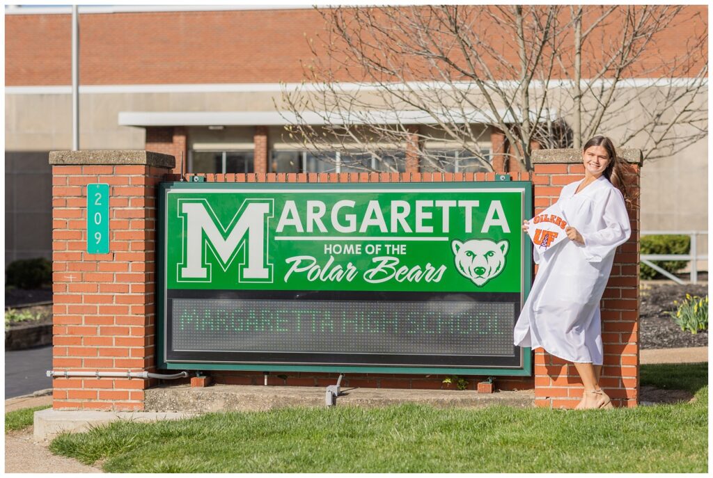 high school senior posing in front of her school's sign in Castalia, Ohio