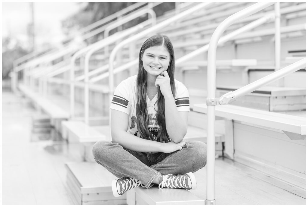 high school senior girl sitting in the stands at Margaretta High School