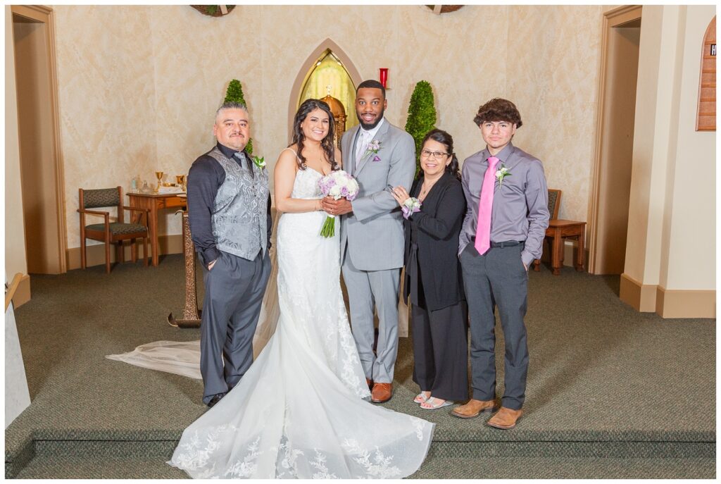 wedding couple posing with family after ceremony in Bradner, Ohio