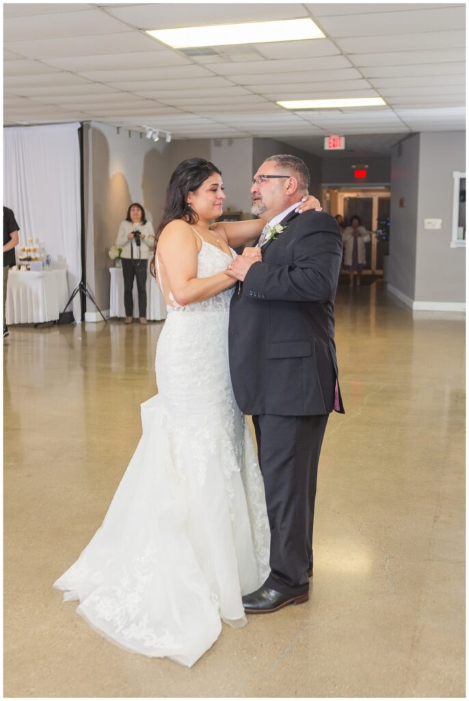 bride crying while dancing with her dad at Ohio wedding reception