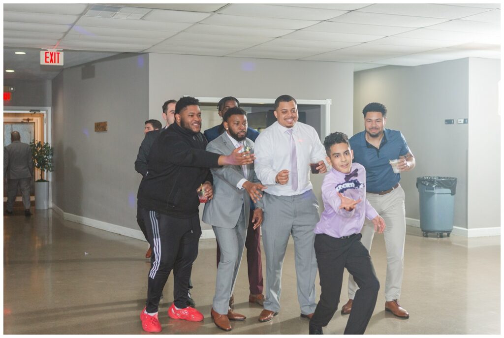 garter toss with wedding reception guests catching it 