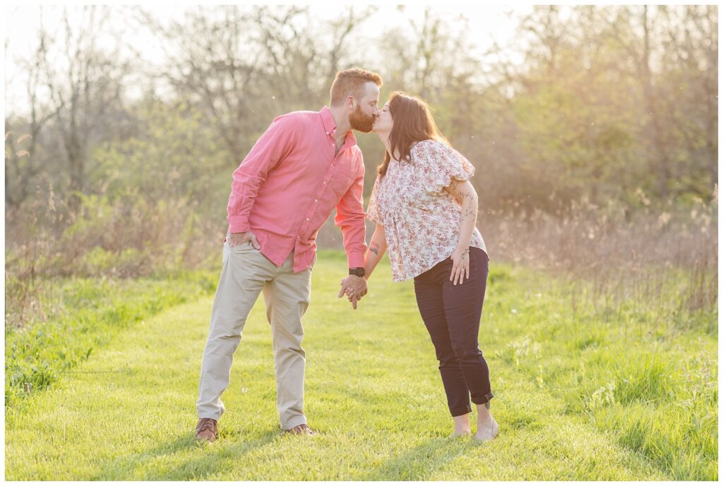 couple kissing in a field for Lindsey, Ohio engagement session