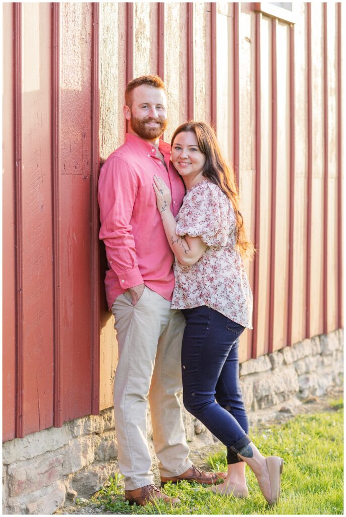 engagement session in front of a red barn outside at Creek Bend Farm