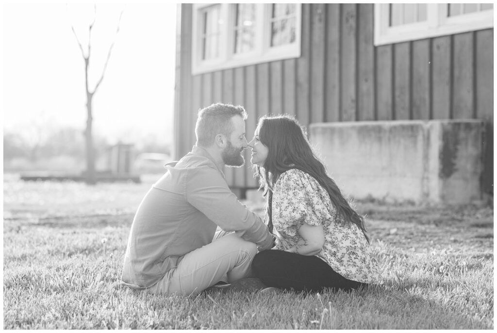 couple sitting on the ground during golden hour engagement session in Ohio