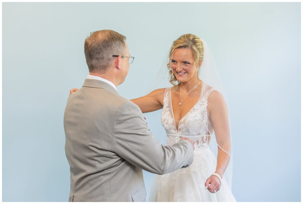 bride and dad's first look at the church before the wedding in Dublin, Ohio