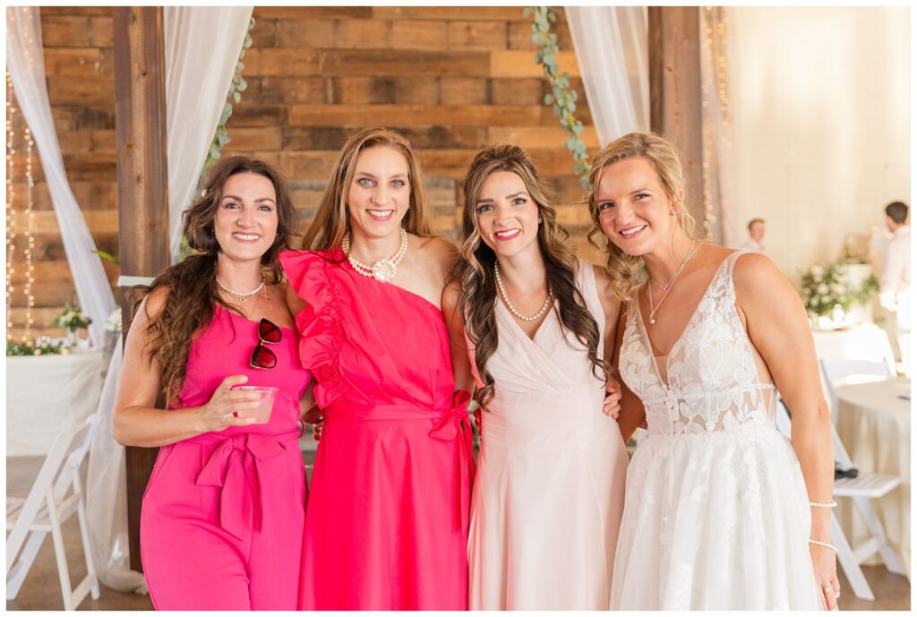 bride posing with friends at the wedding reception in West Mansfield, Ohio