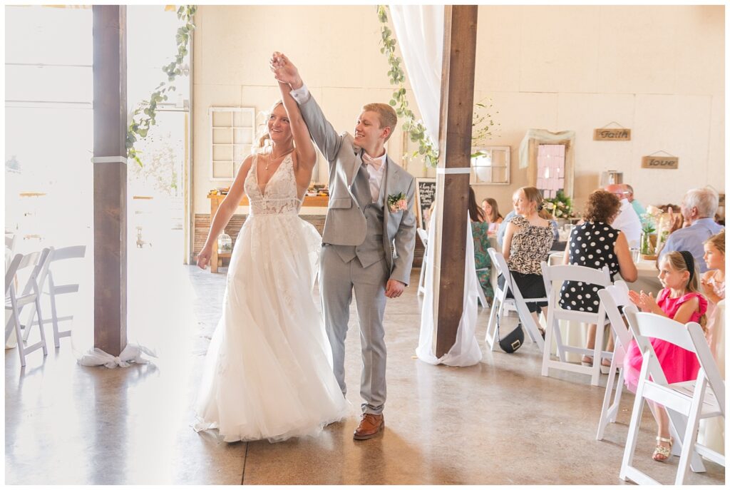 bride and groom make their entrance into the reception at Prairie Stone Farm