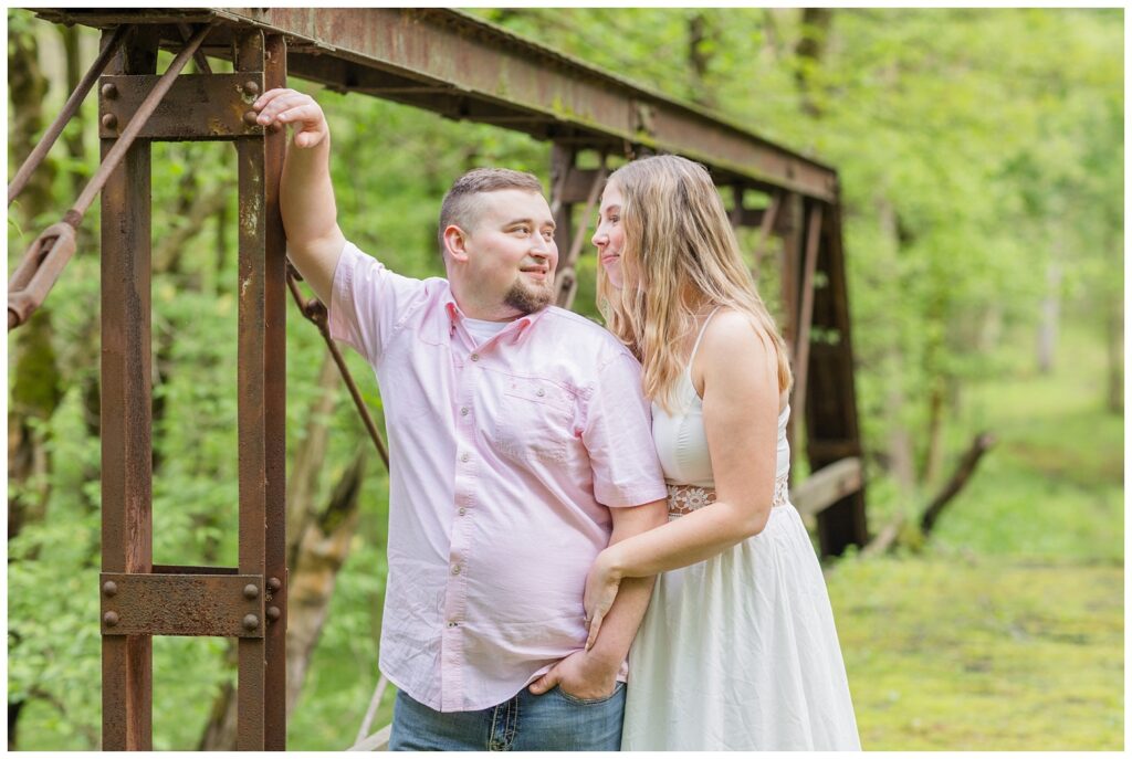 engagement session on an old bridge covered with moss in Willard, Ohio