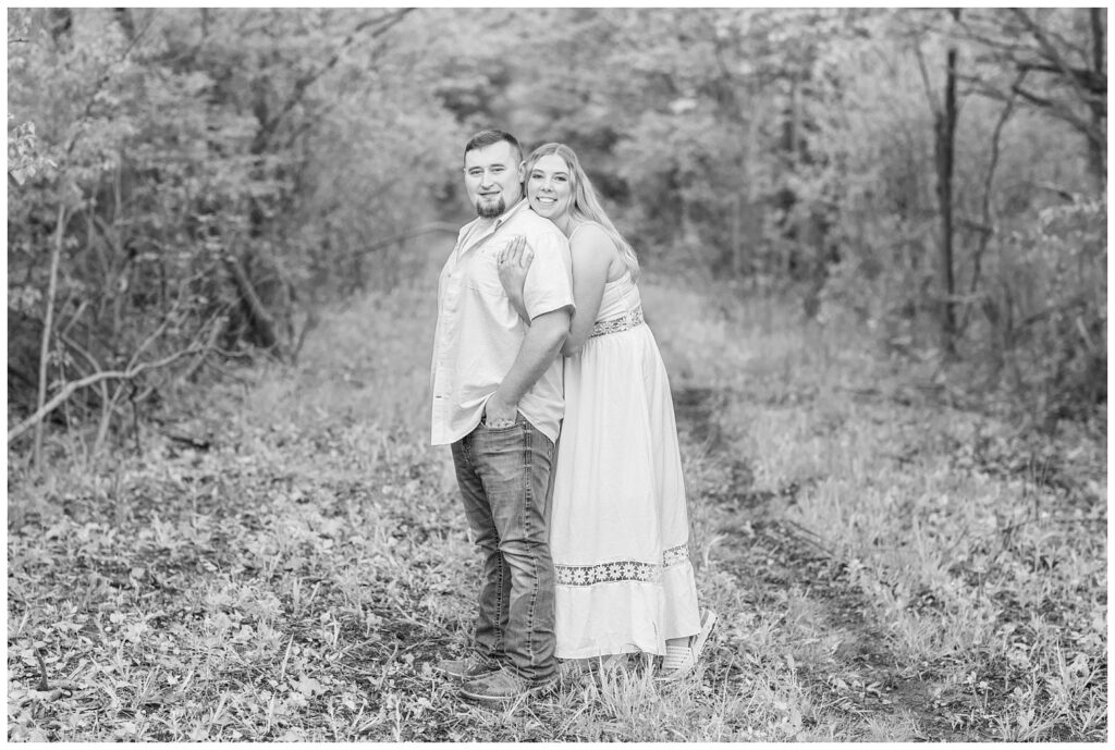 woman hugging her fiance from behind at Willard, Ohio engagement session