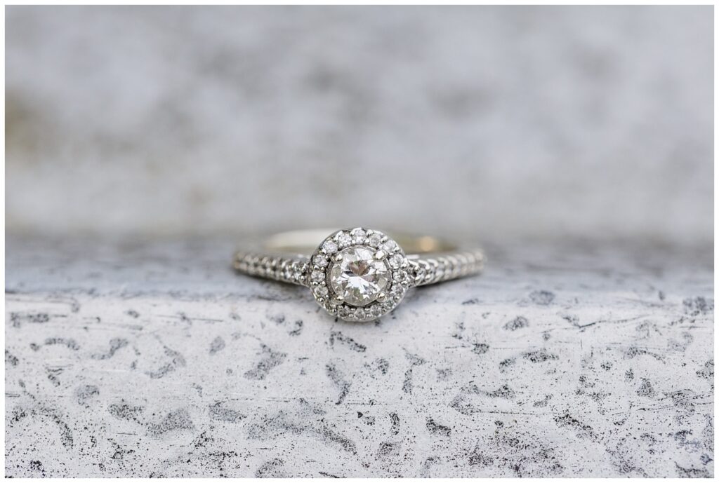 engagement ring sitting on concrete for Willard, Ohio session