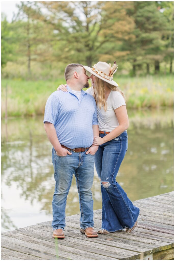 couple standing on a dock next to a pond in Willard, Ohio