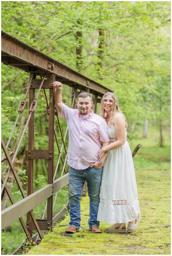 Willard, Ohio engagement photographer standing on a bridge