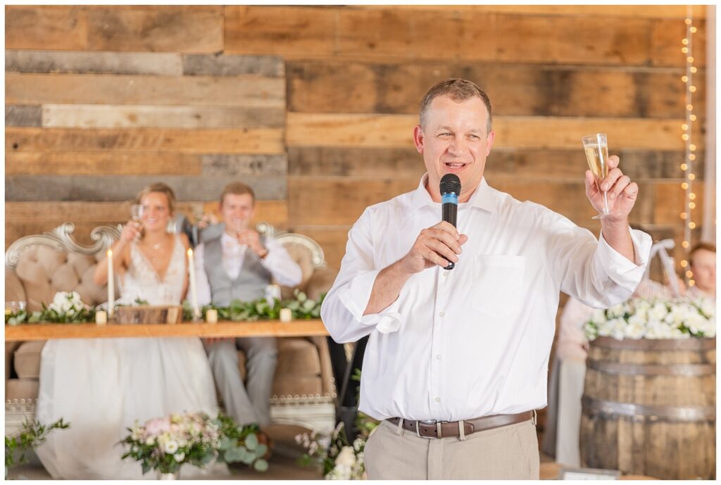 bride's dad giving a champagne toast before dinner at West Mansfield, Ohio wedding venue