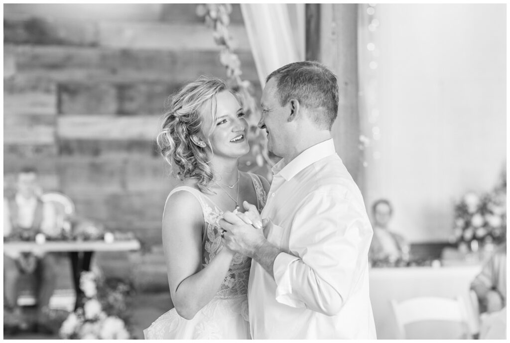 bride dancing with her dad at summer wedding reception at Prairie Stone Farm venue