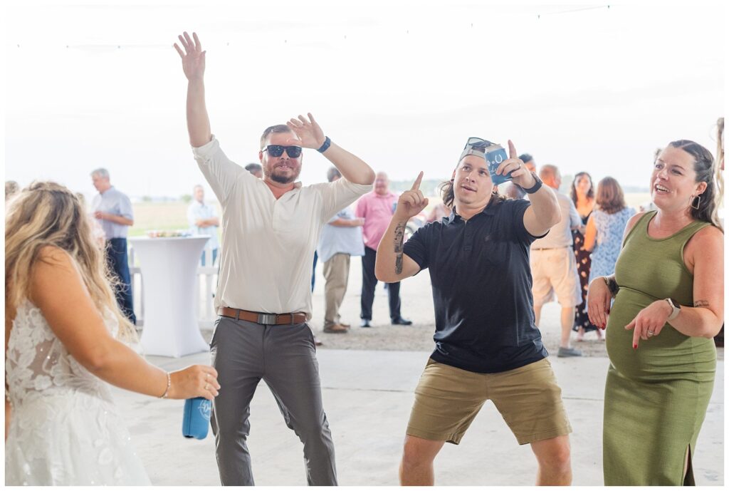 wedding guests dancing and laughing with bride in Risingsun, Ohio reception