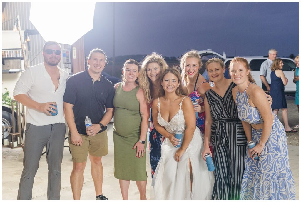 bride posing with her friends at summer country wedding reception in Ohio