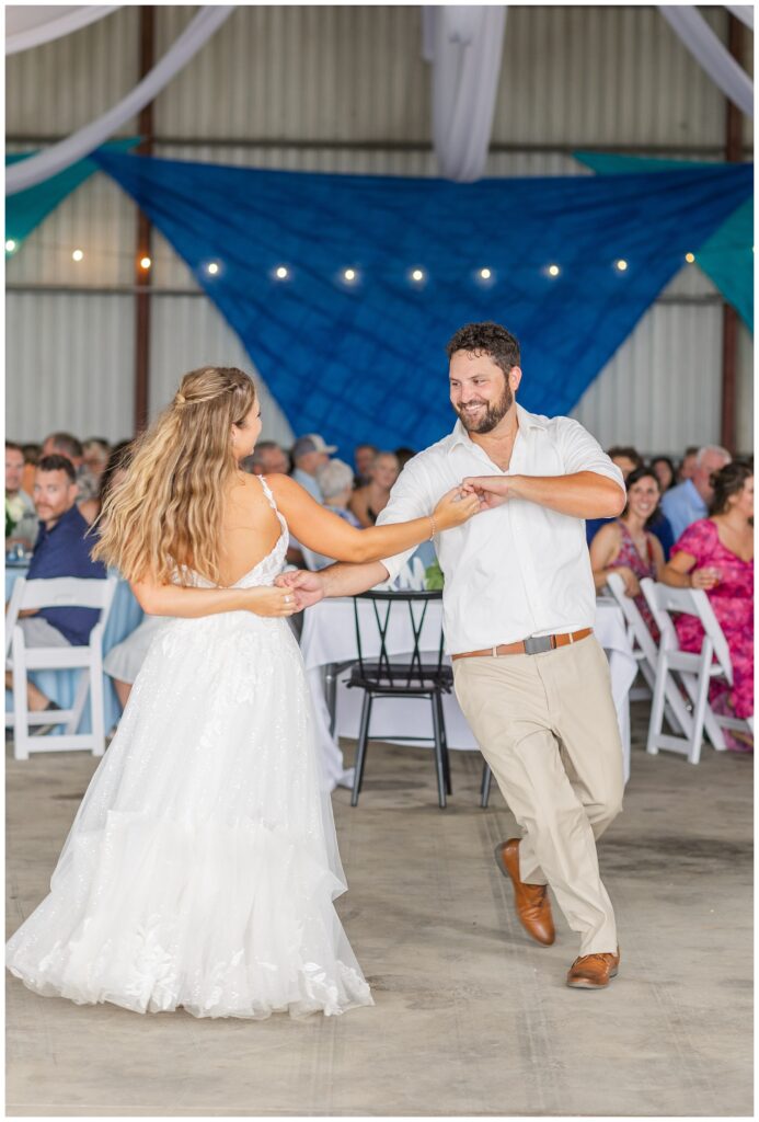 wedding couple dancing during reception at country family farm in Risingsun, Ohio