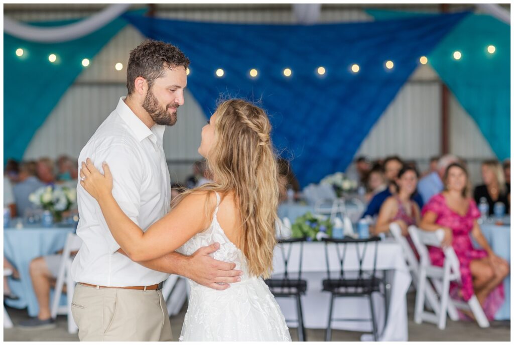 wedding couple dancing during reception at country family farm in Risingsun, Ohio