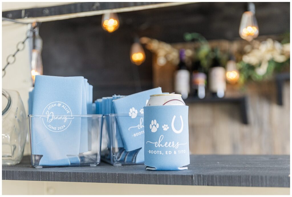 blue and white koozies sitting on top of the mobile bar at Risingsun, Ohio wedding reception