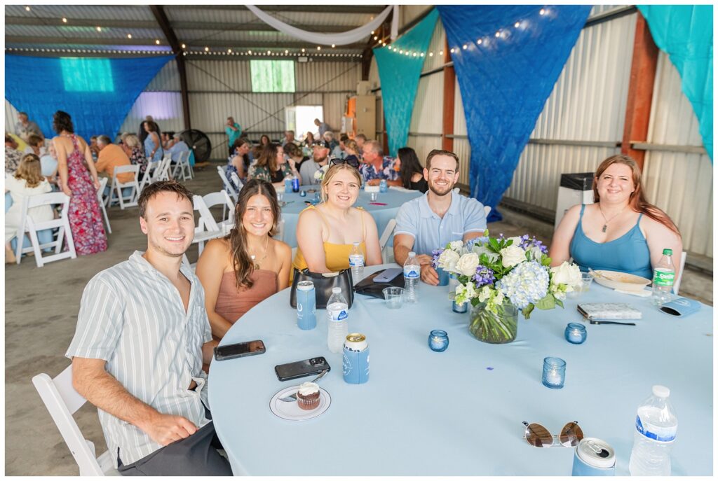 wedding guests gathered around reception table at Risingsun, Ohio