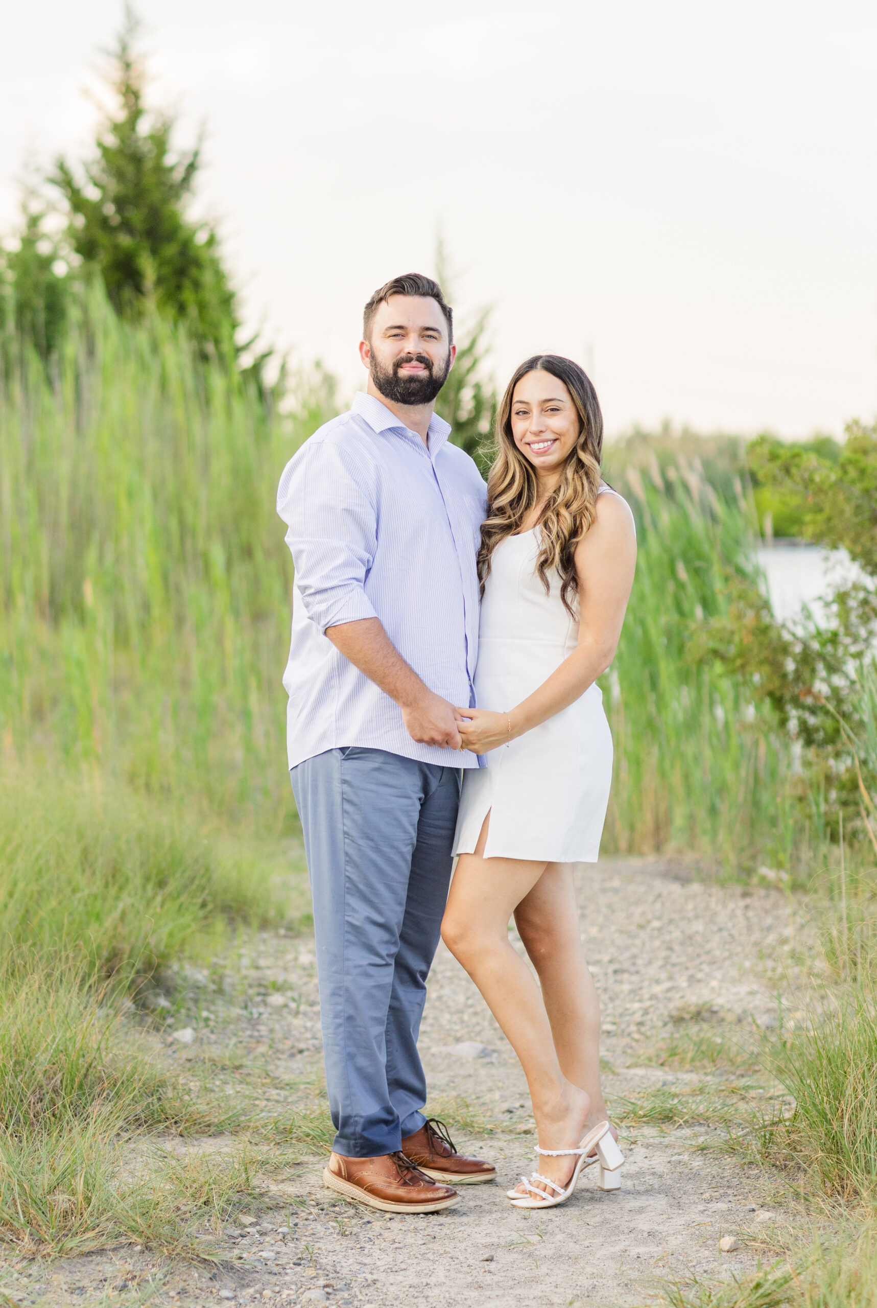 engaged couple standing near the beach at Silver Rock Quarry