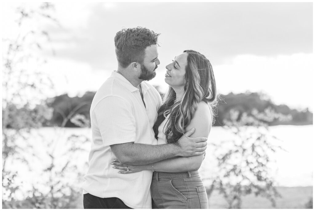 couple hugging each other next to a lake at the Silver Rock Quarry