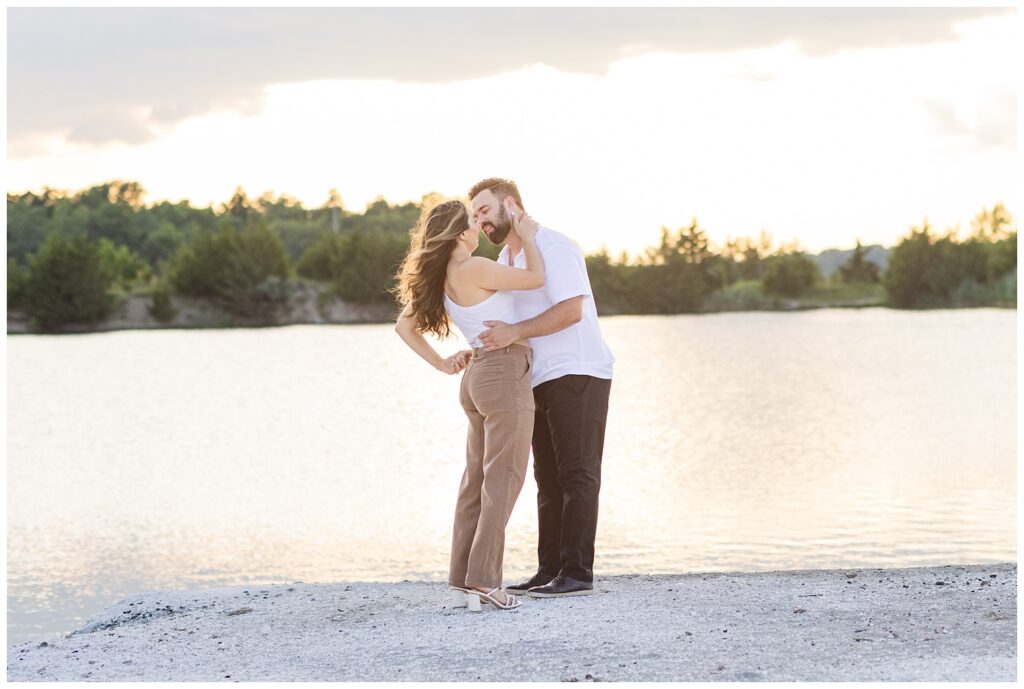 engagement couple embracing at sunset at Silver Rock Quarry