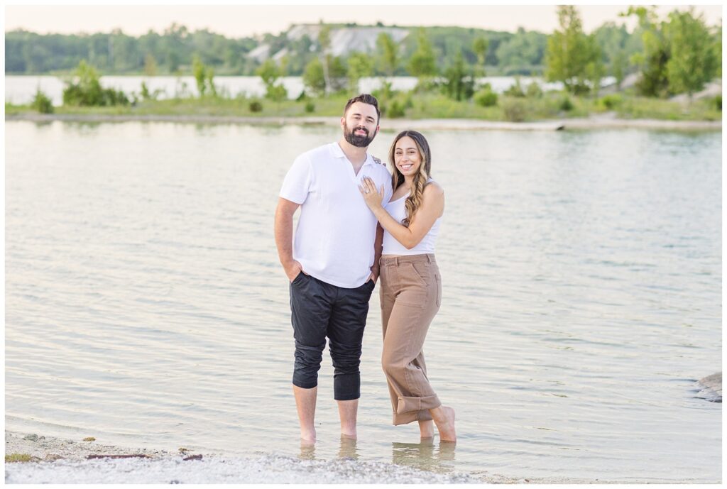 engaged couple standing in the water at Silver Rock Quarry in Ohio