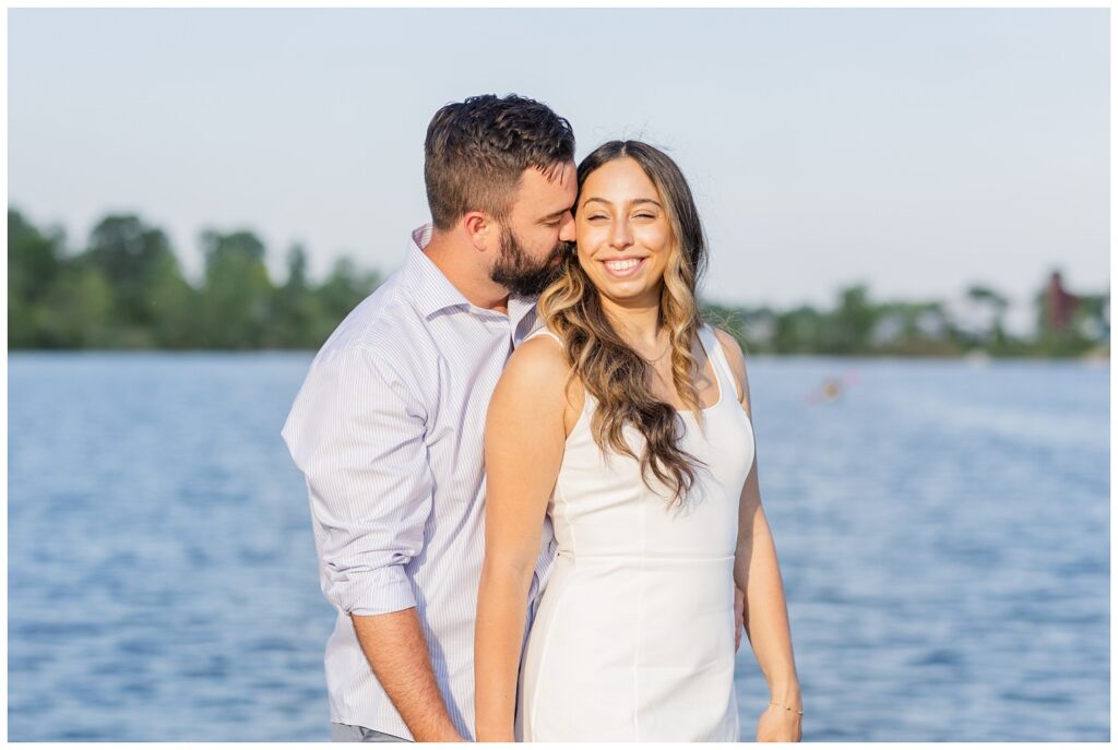 engagement couple posing on a dock next to the lake at Silver Rock Quarry