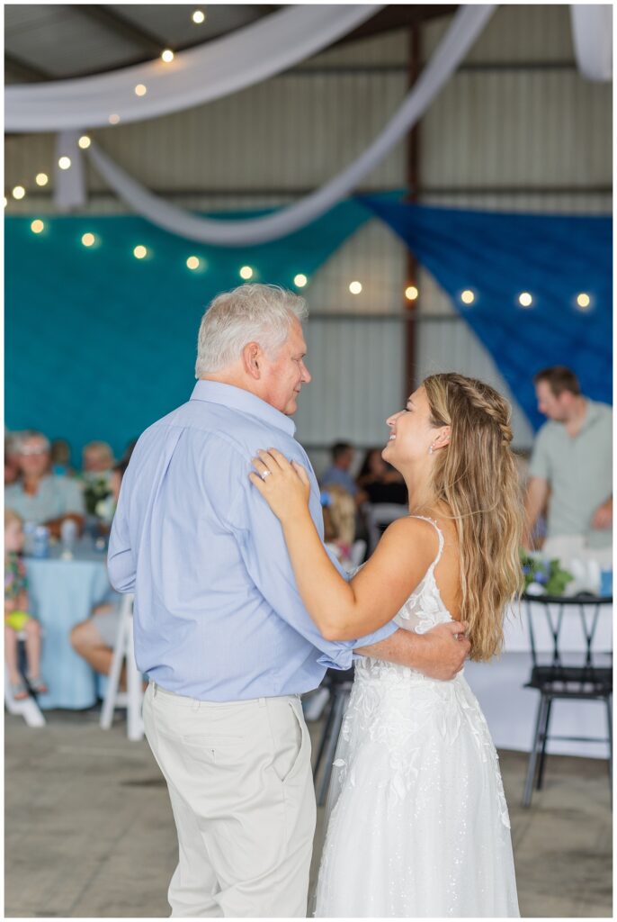 bride having a dance with her dad at wedding reception in metal barn in Ohio