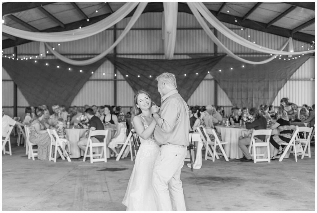 bride having a dance with her dad at Risingsun, Ohio wedding reception in metal barn