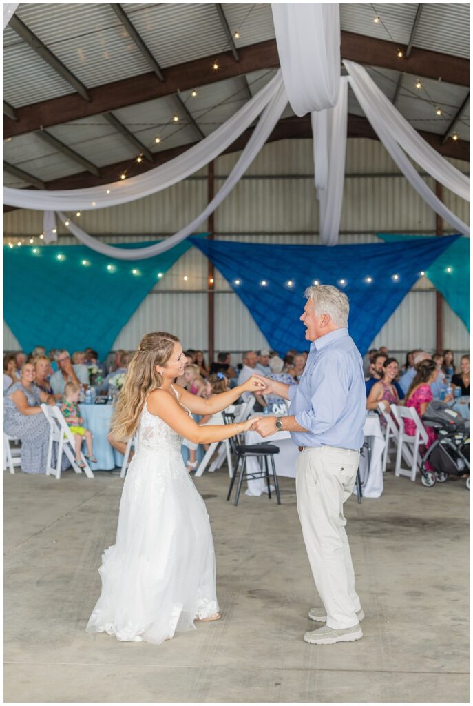 bride having a dance with her dad at Risingsun, Ohio wedding reception in metal barn