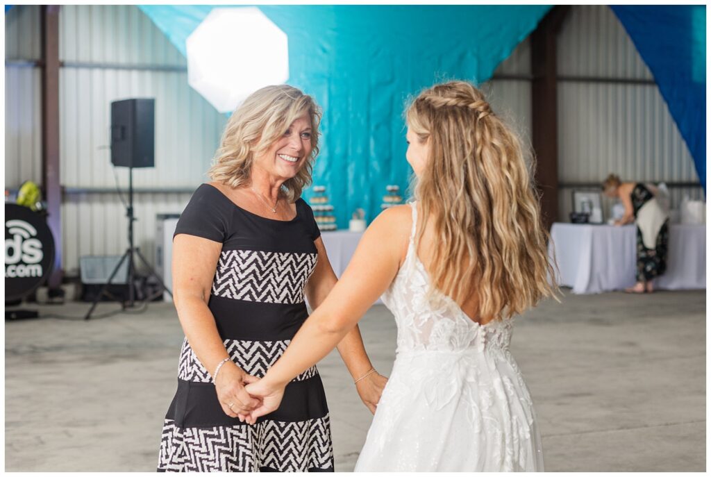 bride dancing with her mom at family farm at Risingsun, Ohio reception