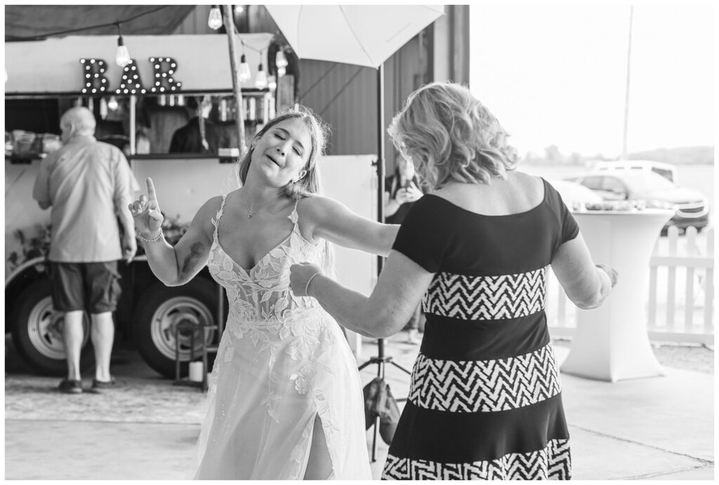 bride dancing with her mom at family farm at Risingsun, Ohio wedding reception