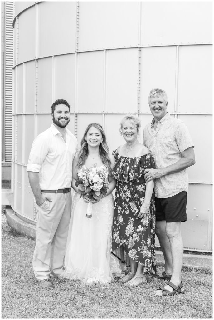 wedding portraits at family farm in Risingsun, Ohio in front of a silo