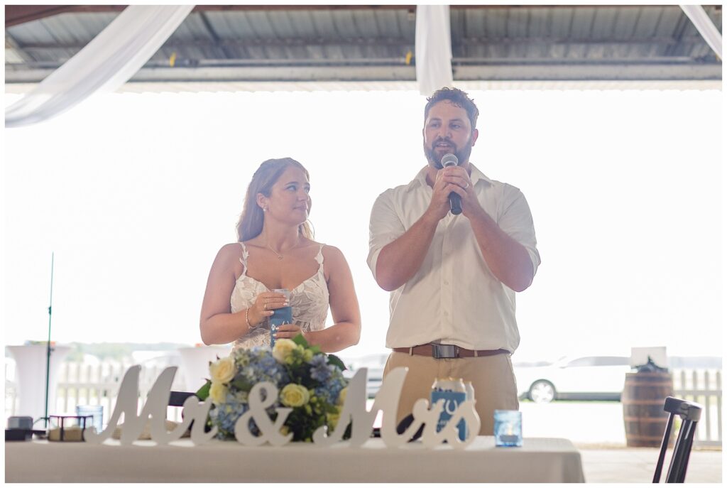 wedding couple thanking their wedding guests at family farm reception in Ohio