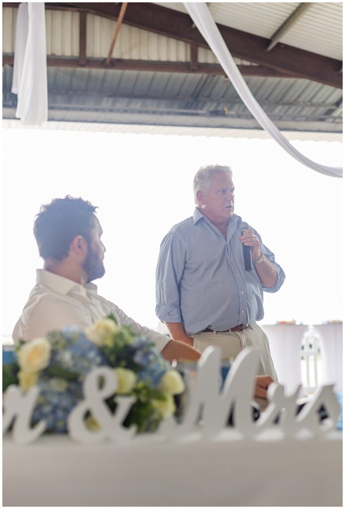 bride's dad giving a wedding toast at reception at family farm in Ohio