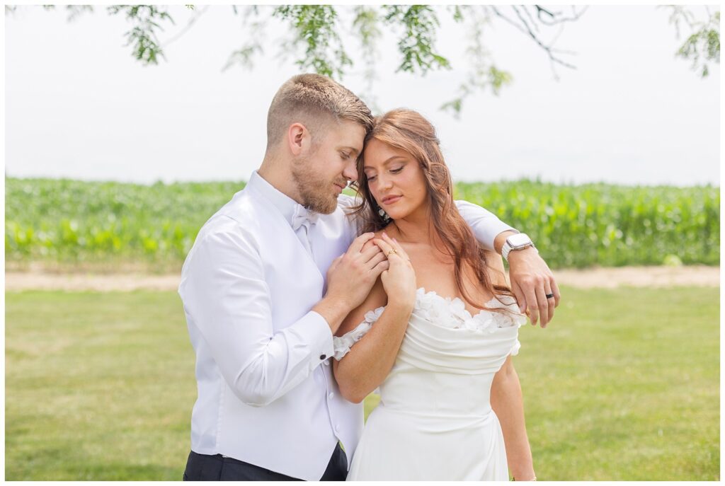 wedding couple posing outside at The Barn at Seneca Hills venue in Tiffin, Ohio