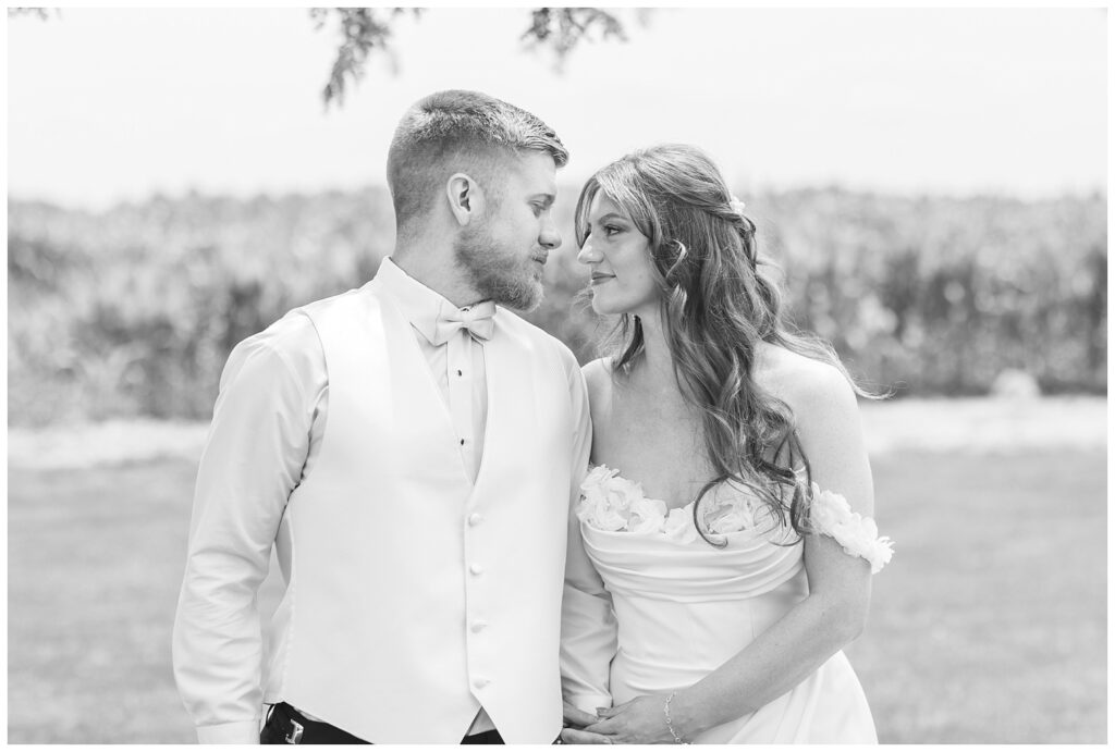 bride and groom looking at each other outside at styled shoot in Tiffin, Ohio