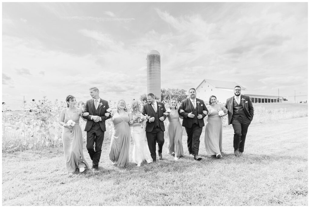 wedding party walking and laughing together at Tiffin, Ohio venue