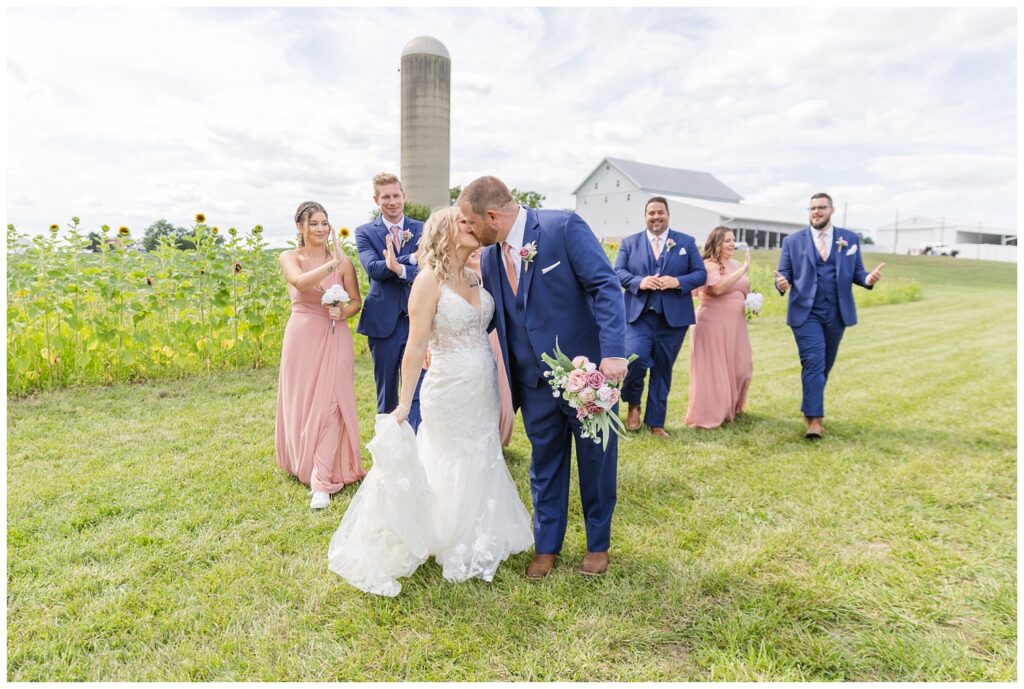 bride and groom walking in front of the bridal party at Arlington Acres